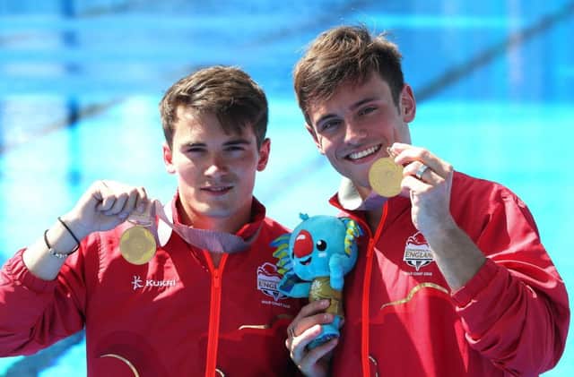 Tom Daley (right) with Daniel Goodfellow after winning gold medals in the men's synchronised 10m platform final at the Gold Coast Commonwealth Games. Picture: Danny Lawson/PA Wire