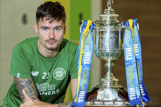 Celtic's Mikael Lustig with the William Hill Scottish Cup. Picture: SNS