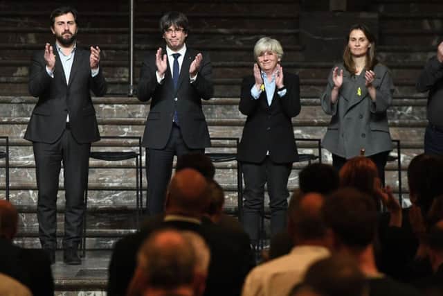 Clara Ponsati with Catalan leader Carles Puigdemont and other councillors. Picture: AFP/Getty Images
