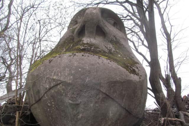 The Floating Head is propped up by a scrapyard 30 years after it was commissioned for the Glasgow Garden Festival. PIC:The Urban Prehistorian.
