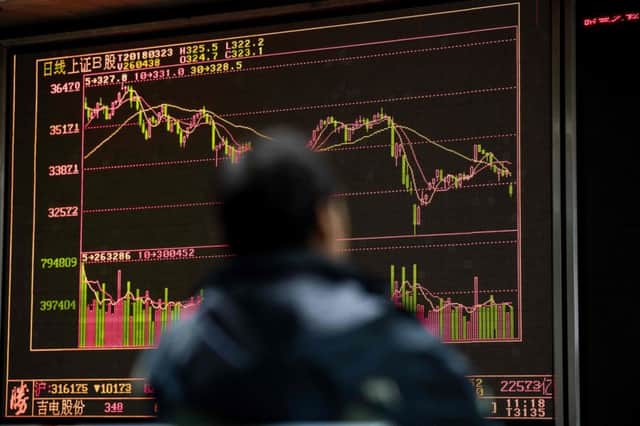 Chinese stocks begin to plunge on a display in Beijing. Picture: Nicolas Asfouri/Getty