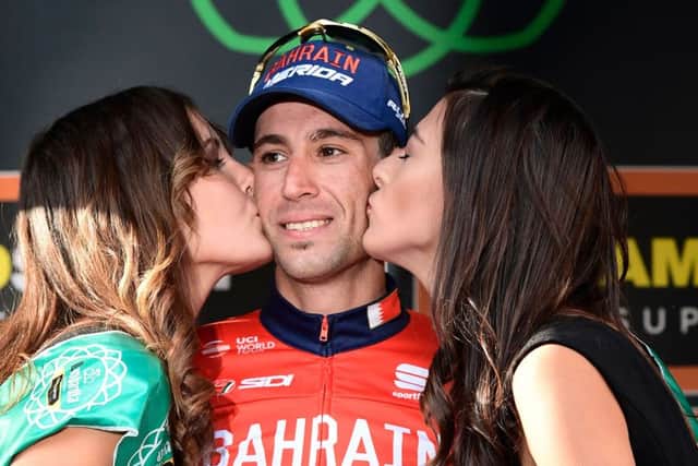 Cyclings Giro dItalia has no intention of getting rid of its podium girls who help winners celebrate. Photograph AFP/Getty Images