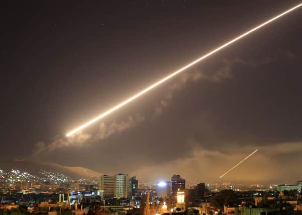 Damascus skies erupt with surface to air missile fire as the U.S. launches an attack on Syria targeting different parts of the Syrian capital Damascus, Syria, early Saturday, April 14, 2018. Syria's capital has been rocked by loud explosions that lit up the sky with heavy smoke. Pic: AP/Hassan Ammar