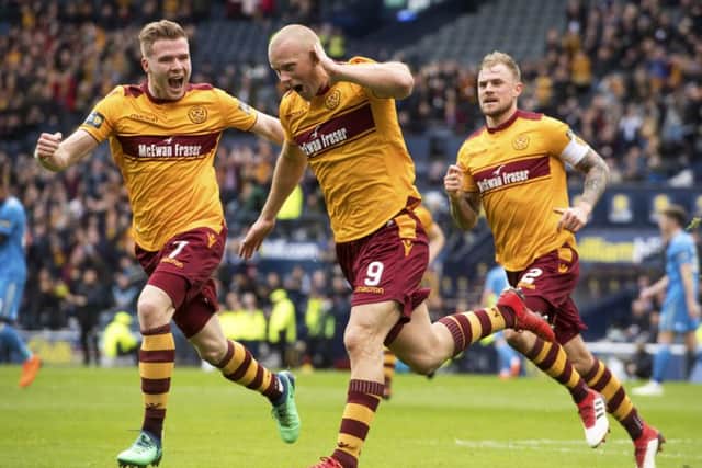 Motherwell's Curtis Main wheels away after opening the scoring. Picture: SNS/Rob Casey