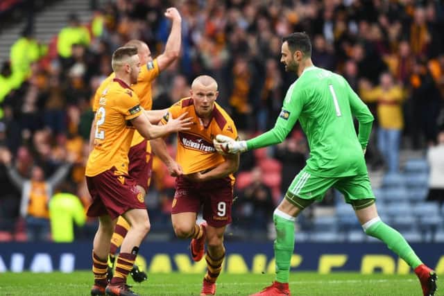 Motherwell's Curtis Main wheels away after his second goal. Picture: SNS/Craig Williamson