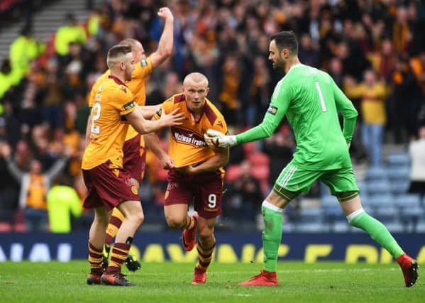 Motherwell's Curtis Main wheels away after his second goal. Picture: SNS/Craig Williamson