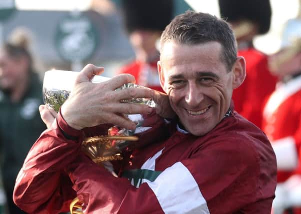 Winning jockey Davy Russell celebrates his triumph. Photograph: David Davies/PA
