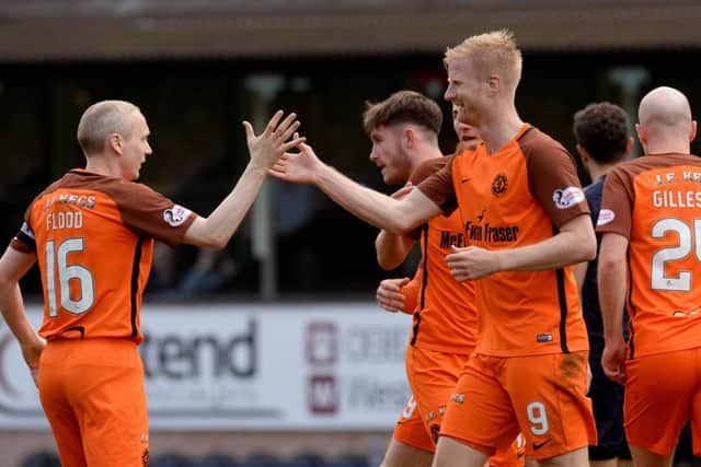 Dundee Utd's Thomas Milkesen celebrates his goal with Willo Flood. Picture: SNS/Sammy Turner