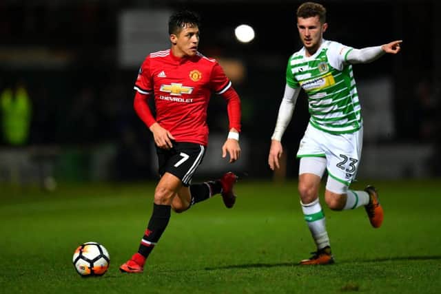 Tom James tracks Manchester United forward Alexis Sanchez during an FA Cup tie in January. Picture: Getty Images