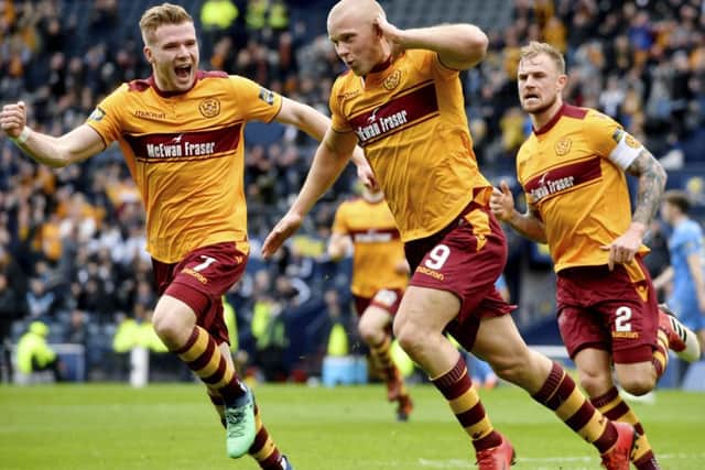 Curtis Main wheels away in celebration after opening the scoring for Motherwell. He was to score a second on a dominant day. Picture: SNS