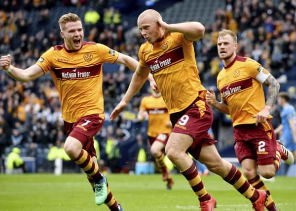 Curtis Main wheels away in celebration after opening the scoring for Motherwell. He was to score a second on a dominant day. Picture: SNS