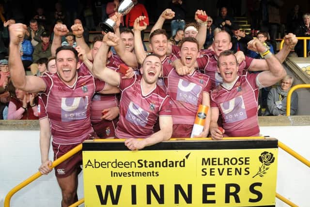 The victorious Watsonians side celebrate with the trophy after their superb win in the final against hosts Melrose on Saturday. Picture: Fotosport