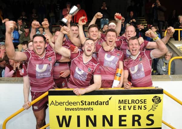 The victorious Watsonians side celebrate with the trophy after their superb win in the final against hosts Melrose on Saturday. Picture: Fotosport