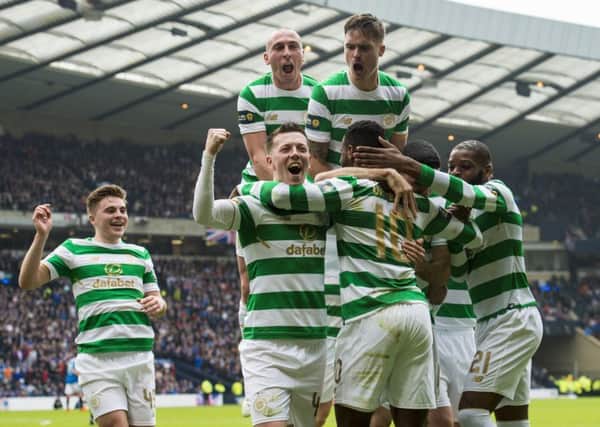 Moussa Dembele celebrates his goal with team-mates. Picture: SNS Group