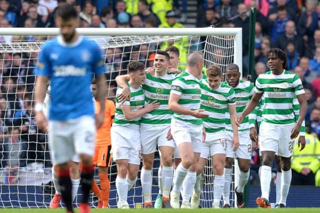 Daniel Candeias cuts a dejected figure as Celtic celebrate Tom Rogic's opener. Picture: Getty Images