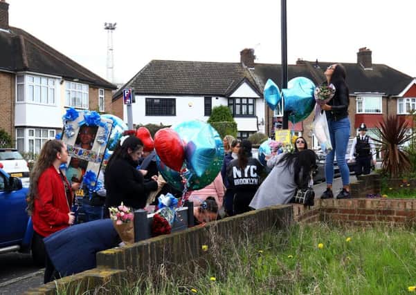 Friends and relatives of Henry Vincent bring birthday tributes to the scene on South Park Crescent in Hither Green. Picture: Gareth Fuller/PA Wire