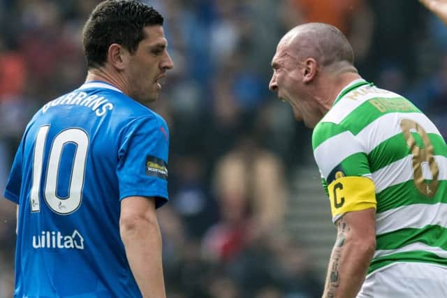 Celtic's Scott Brown reacts after he is fouled by Graham Dorrans. Picture: SNS