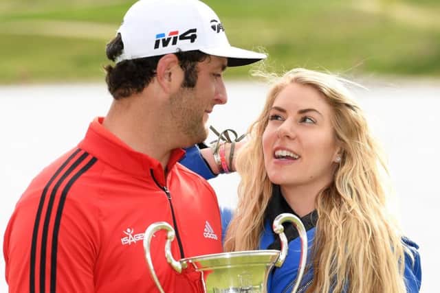 World No 4 Jon Rahm celebrates winning on home soil in Spain with his girlfriend, Kelley Cahill. Picture: Getty.