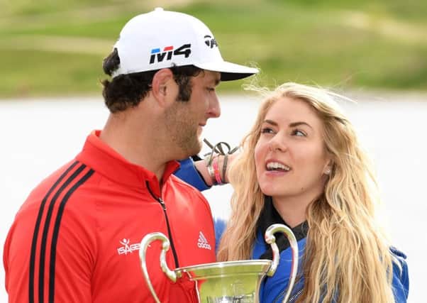 World No 4 Jon Rahm celebrates winning on home soil in Spain with his girlfriend, Kelley Cahill. Picture: Getty.