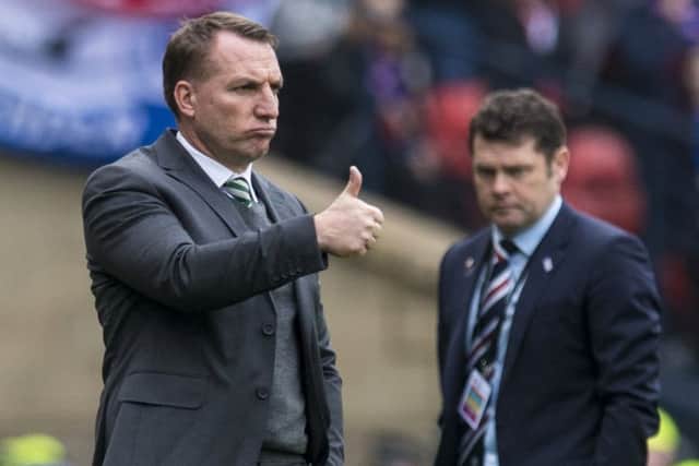 A thumbs up from Celtic manager Brendan Rodgers as Rangers' Graeme Murty looks disconsolate. Picture: Craig Williamson/SNS