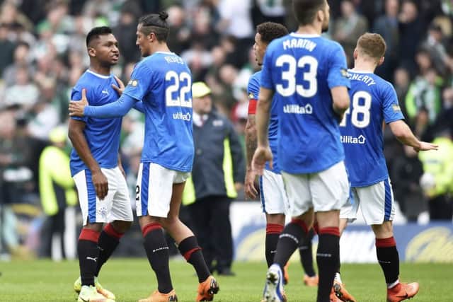 Bruno Alves can be seen trying to calm Alfredo Morelos as he shouts at Greg Docherty (partially obscured, far right). Picture: SNS Group