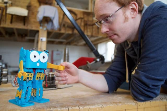 Football-playing robot who could teach the next generation some neat tricks