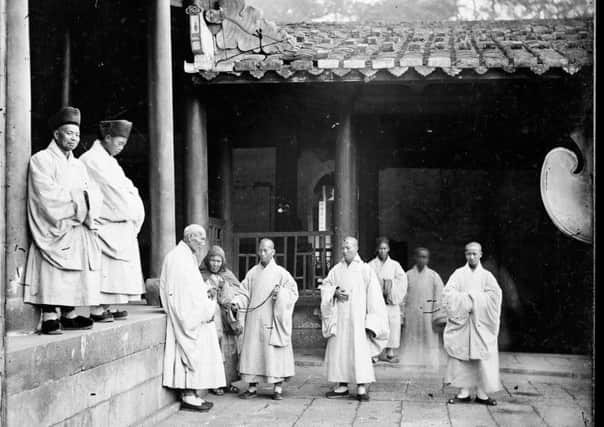 Buddhist priests at Yongquan Monastery, Drum Mountain, Fuzhou, China. At the time of Thomsons visit about 200 monks lived there. He was intrigued by their robes which he thought resembled the monastic garb of medieval Europe.