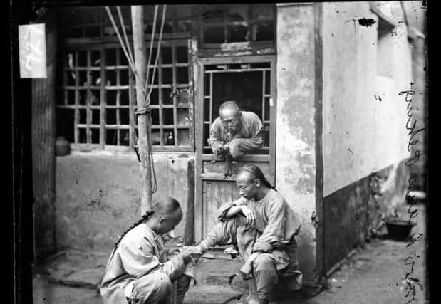 A travelling chiropodist in Beijing, 1871 or 1872. Until the advent of modern medicine, many people in China sought help from untrained doctors and herbal remedies for their ailments.