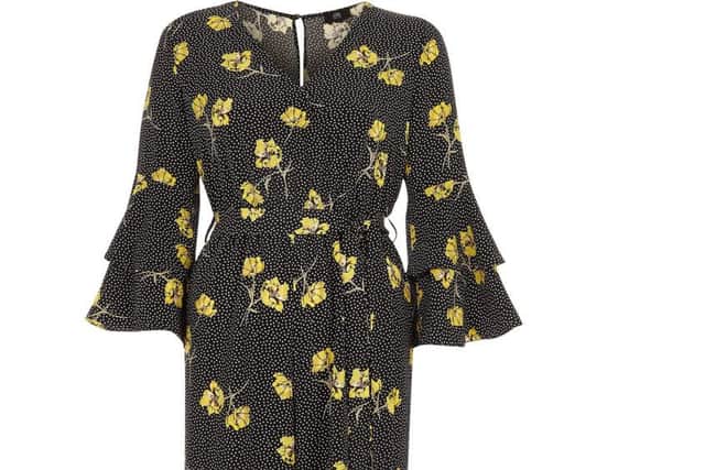 River Island Petite Black Floral Spot Frill Jumpsuit, Â£60, available from River Island.