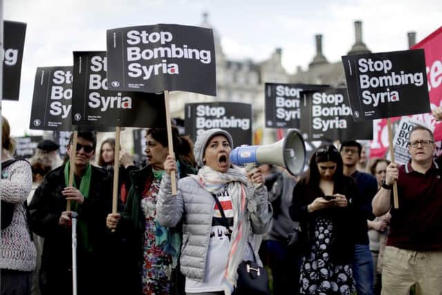 Protests against the campaign in Syria. (AP Photo/Matt Dunham)