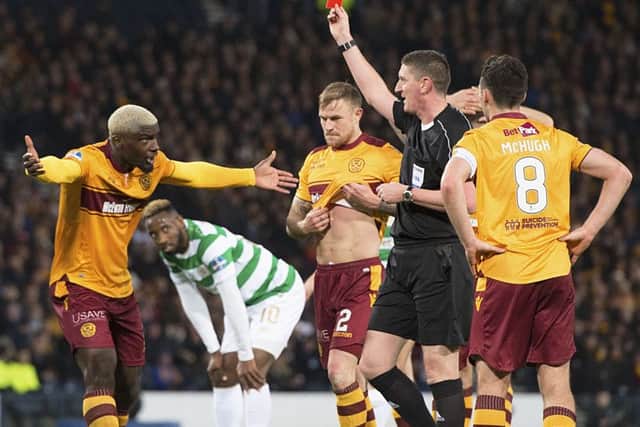 Referee Craig Thomson shows Cedric Kipre of Motherwell the red card in the Betfred Cup final against Celtic. Picture: Ross Parker/SNS
