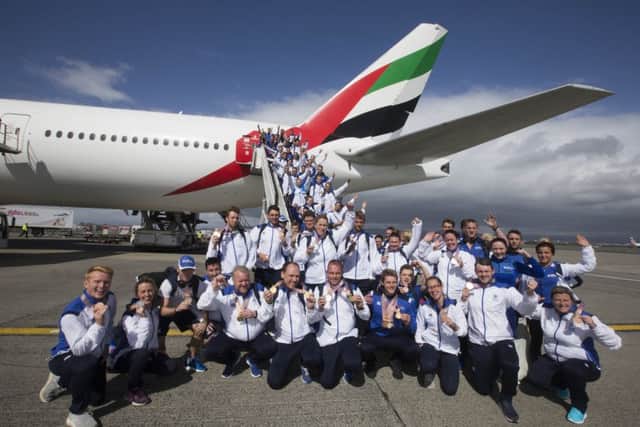 Team Scotland return to Glasgow Airport. Picture: Jeff Holmes