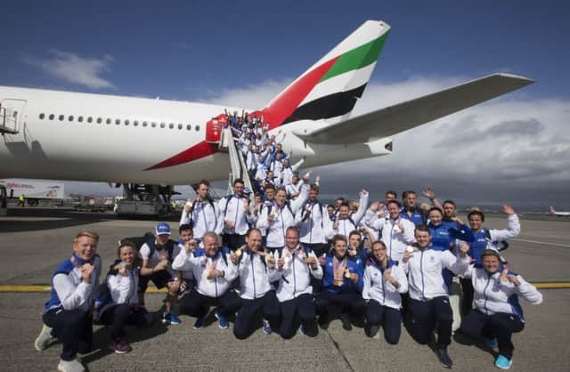 Team Scotland return to Glasgow Airport. Picture: Jeff Holmes