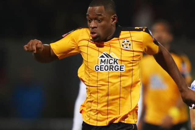 Uche Ikpeazu, left, in action for Cambridge United, is set to sign a pre-contract with Hearts. Picture: Clive Mason/Getty Images