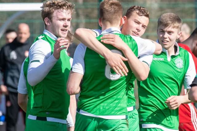 The Hibs players celebrate Lewis Allan's goal. Pic: Ian Georgeson