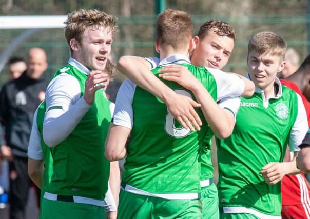 The Hibs players celebrate Lewis Allan's goal. Pic: Ian Georgeson