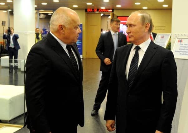 Dmitry Kiselyov, an outspoken Russian journalist, with president Vladimir Putin in 2017. Mr Kiselyov said Russian interest in Scotch whisky would drop. Picture: Wikicommons