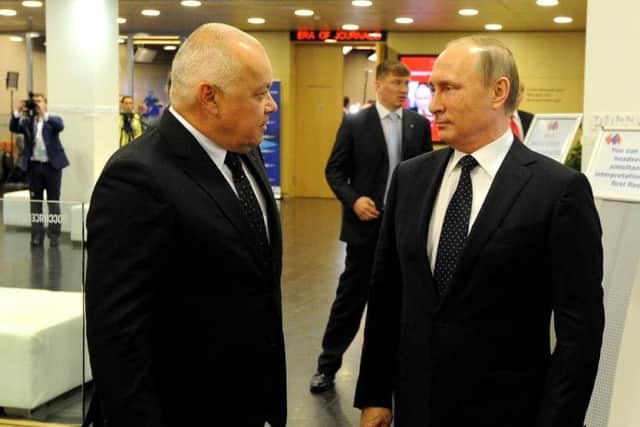 Dmitry Kiselyov, an outspoken Russian journalist, with president Vladimir Putin in 2017. Mr Kiselyov said Russian interest in Scotch whisky would drop. Picture: Wikicommons
