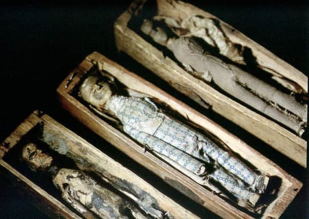 Three of the tiny coffins found on Arthur's Seat in 1836. Picture: TSPL