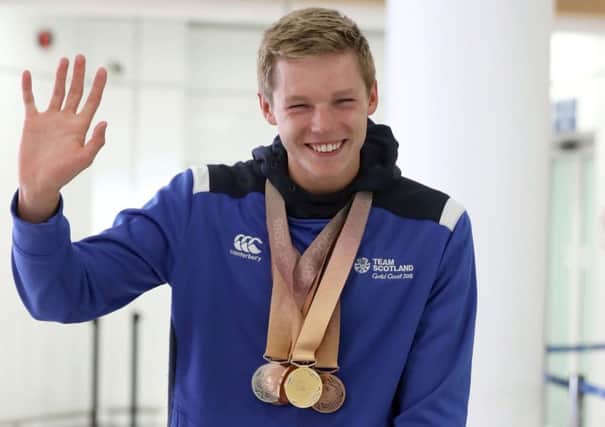 Swimmer Duncan Scott arrives at Glasgow Airport. Picture: Andrew Milligan/PA Wire