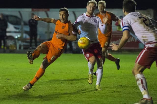 Dundee United's Scott McDonald scores his second of the night. Picture: Paul Devlin/SNS