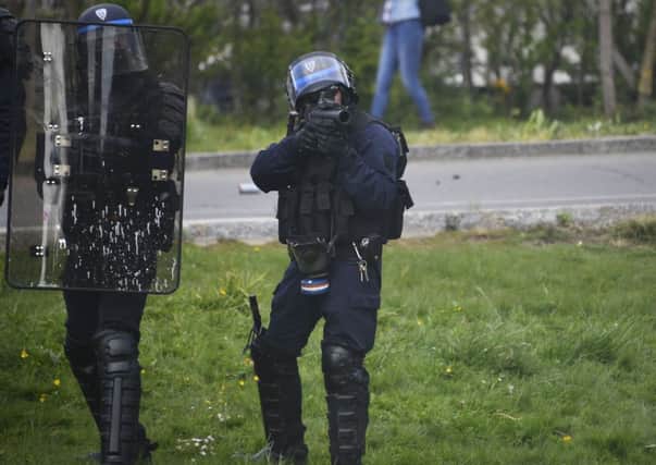 A police officer holds a riot control weapon during a demonstration in support of the Notre-Dame-des-Landes anti-airport camp in Nantes, western France (AFP/Getty)