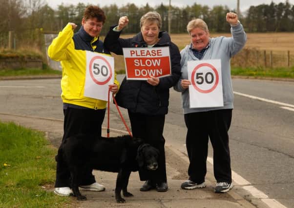 Alison Izatt, Ann Montague (Rosewell Community Council Secretary) and Sandra Muir (Rosewell Community Council Treasurer) at the A6094 where a stretch of road is changing speed limit from the national speed limit of 60 mph down to 50mph