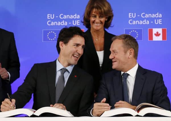 Canadian Prime Minister Justin Trudeau (left) and EU Council President Donald Tusk are all smiles as they sign the CETA trade deal; it remains to be seen if the UK will reach such an amicable settlement (Picture: AFP/Getty)