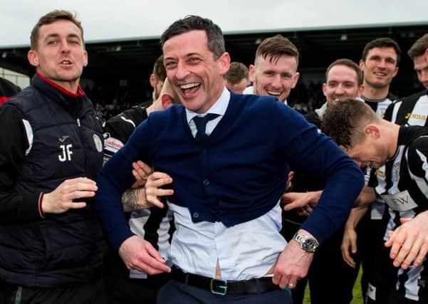 Jack Ross celebrates with his players as St Mirren win the Championship title. Picture: SNS