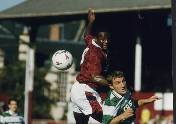 Justin Fashanu tussles with Celtic's Tony Mowbray in a game at Tynecastle in 1993. Picture: EN
