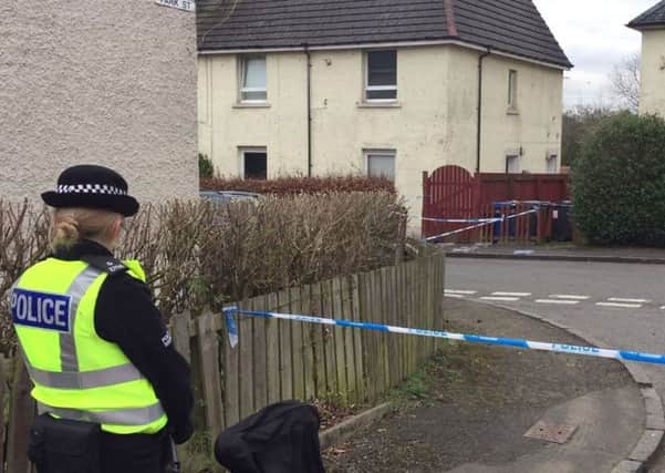 The scene in Alexander Place, Kirkintilloch, where a 32 year old woman has been found dead. Picture: Conor Riordan/PA Wire