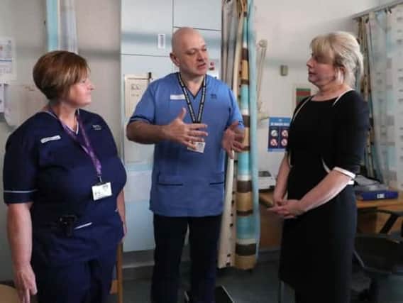 Shona Robison, right, has defied calls to quit since the NHS Tayside scandal emerged