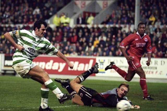 Darren Jackson fires the ball past Jim Leighton to score against Aberdeen during Celtic's title-winning season in 1997-98. Picture: SNS