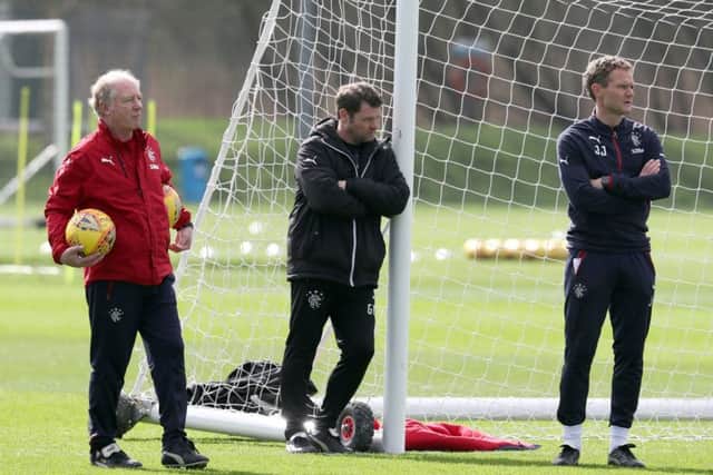 Rangers manager Graeme Murty, centre, takes a moment for quiet reflection during training. Picture: PA.
